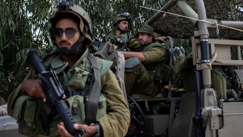Israeli reservists set aside politics for massive mobilization to bolster IDF