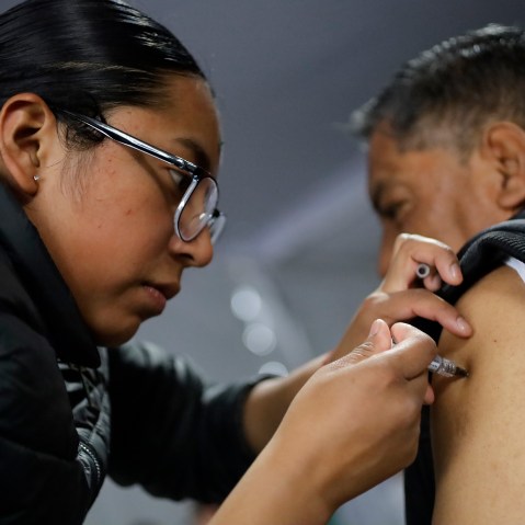 A health worker administers a vaccine during a mass vaccination campaign in Mexico City, Mexico.