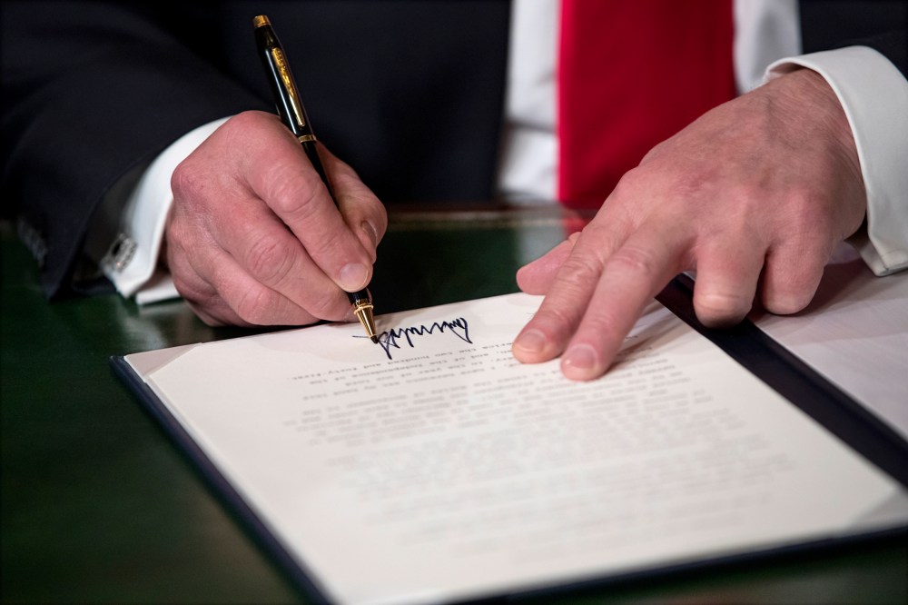 Image: President Donald Trump signs his cabinet nominations into law on Jan. 20, 2017.