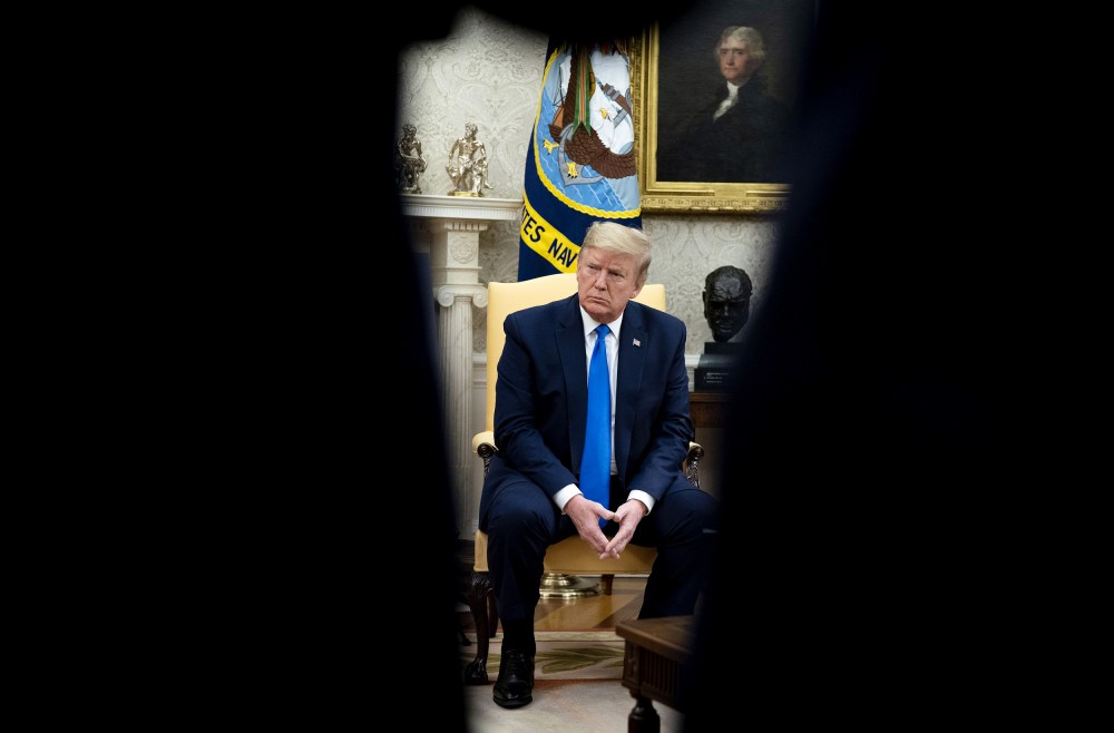 Image: President Donald Trump listens during a meeting with Iowa Governor Kim Reynolds on reopening businesses amid coronavirus at the Oval Office on May 6, 2020.