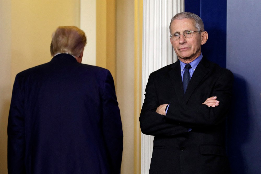 Dr. Anthony Fauci reacts as U.S. President Donald Trump leaves after his press briefing on the coronavirus at the White House on March 26, 2020.