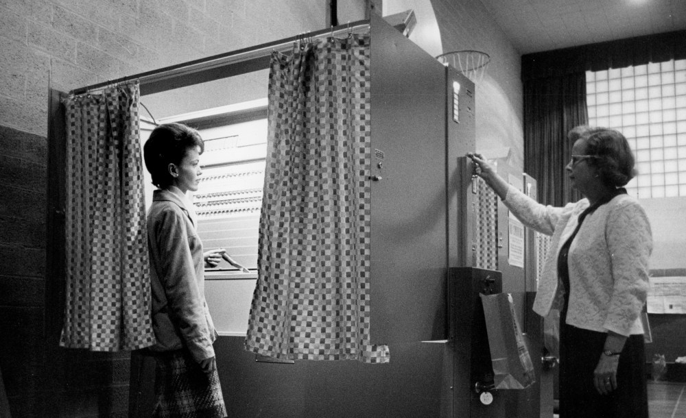 Image: A precinct official clears an automatic voting machine in Jamestown, N.Y., in 1965.