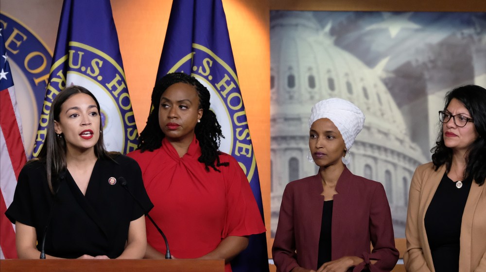 Image: Congresswomen Alexandria Ocasio-Cortez, Ayanna Pressley, Ilhan Omar and Rashida Tlaib on stage