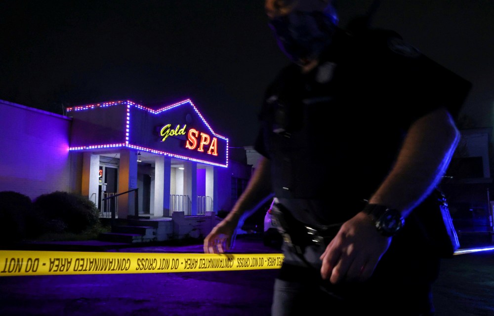 Image: A police officer at the taped scene outside of Gold Spa in Atlanta, Georgia.
