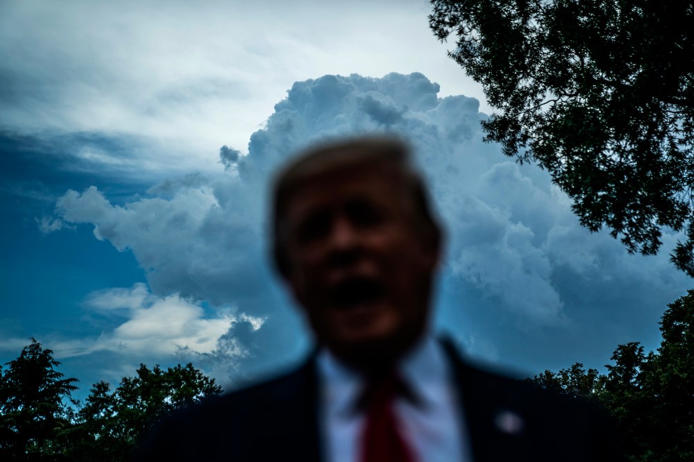 IMage: Then-President Donald Trump speaks to the media on the South Lawn of the White House in 2019.