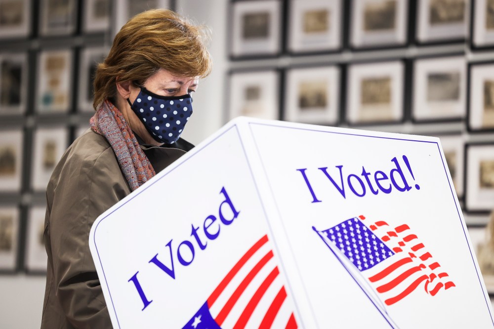A woman casts her vote