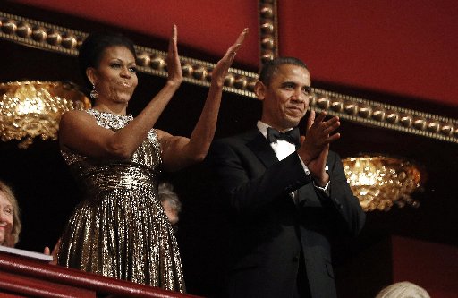 U.S. President Barack Obama and first lady Michelle Obama applaud on the balcony as they attend the 2012 Kennedy Center Honors at the Kennedy Center in Washington, December 2, 2012.     (Photo: Reuters/Jason Reed)