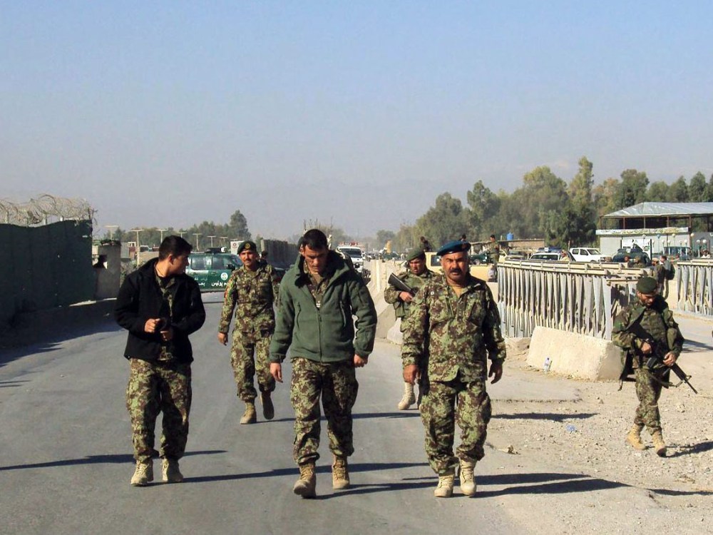 Afghan National Army soldiers stand guard outside the US military base after a fierce gun battle between Taliban militants and Afghan security forces, in Jalalabad, Afghanistan, 02 December 2012.  (Photo by Abdul Mieed/EPA)