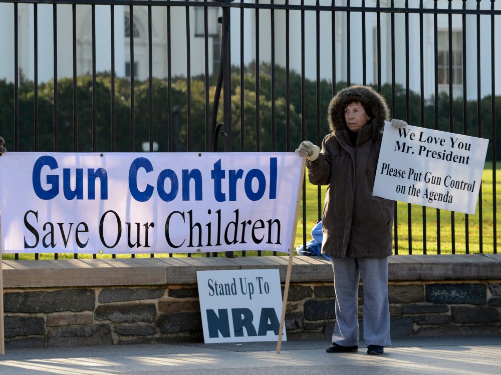Supporters of gun control hold a sign that reads 'Gun Control Save Our Children', outside the White House in Washington DC, USA, 15 December 2012.  Reports state on 14 December 2012 that a gun man unleashed a hail of gunfire that killed 20 children and...