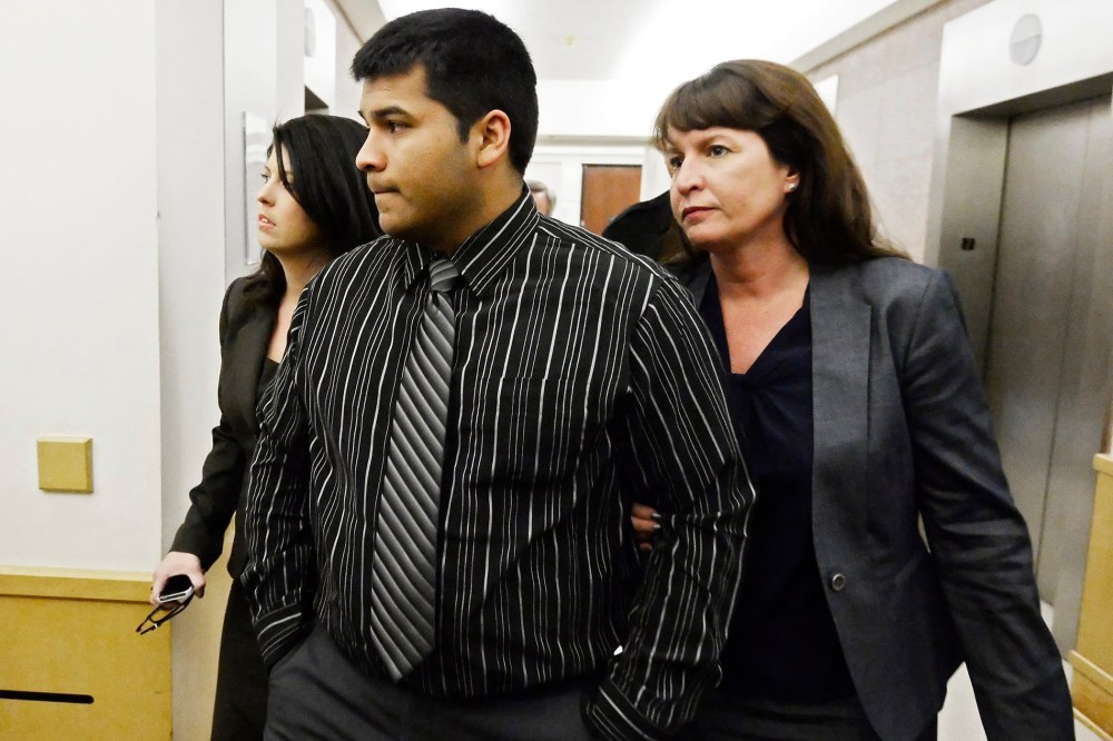 Erick Muñoz, husband of Marlise Muñoz walks into the Tarrant County court house with attorneys in Fort Worth, Texas, USA, Jan. 24, 2014.
