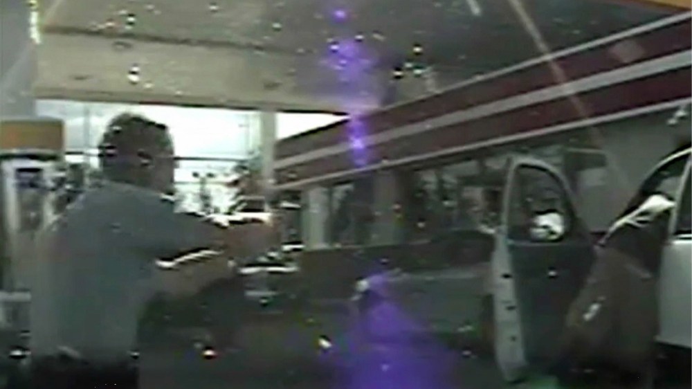 A frame grab reportedly from a South Carolina state trooper dashcam made available by the South Carolina Department of Public Safety on Sept. 25, 2014 shows South Carolina State Trooper Sean Groubert (L) as he moves across the screen shouting at unarmed L