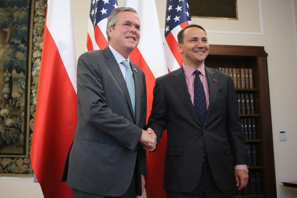 Polish Parliament Speaker Radoslaw Sikorski (R) shakes hand with U.S. politician Jeb Bush (L) before their meeting in Warsaw, Poland, June 11, 2015. (Photo by Laszek Szymanski/EPA)