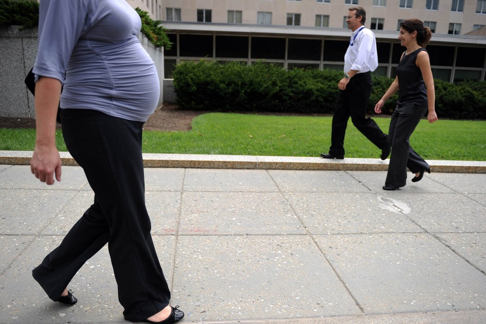 A pregnant woman walks outside the State Department on Aug. 5, 2010 in Washington, DC.