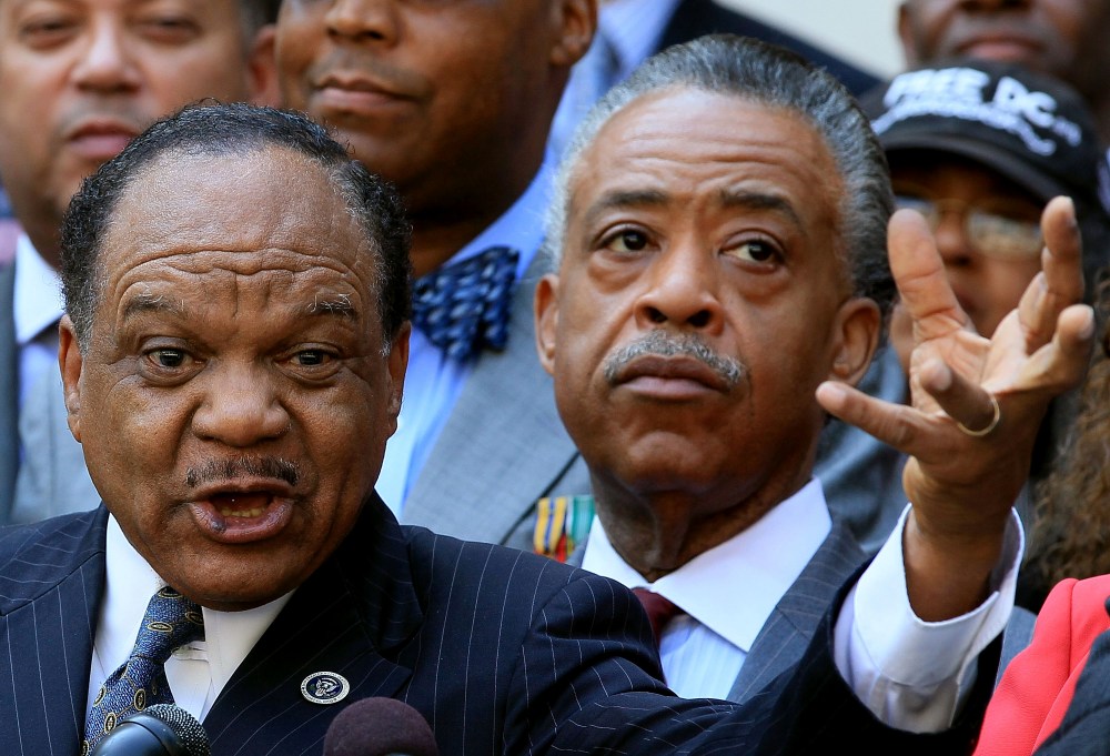 The Rev. Walter Fauntroy (L) gestures as he speaks, while the Rev. Al Sharpton (R), listens during a news conference in front of the John A. Wilson Building on Aug. 27, 2010 in Washington, DC. (Photo by Mark Wilson/Getty)