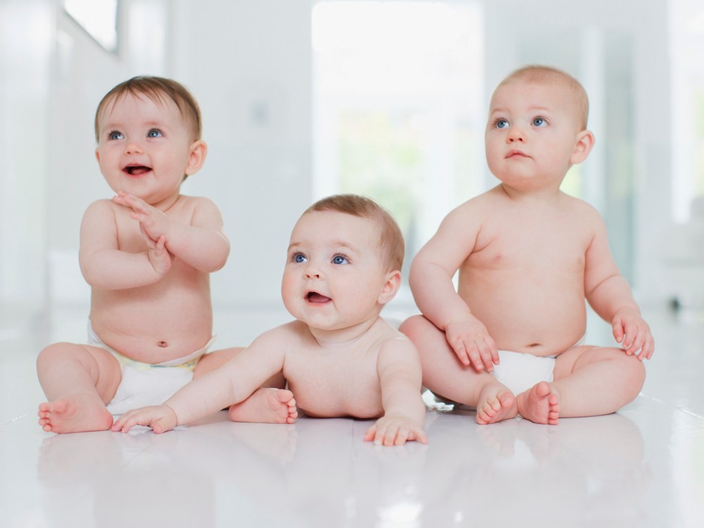 Smiling babies on floor