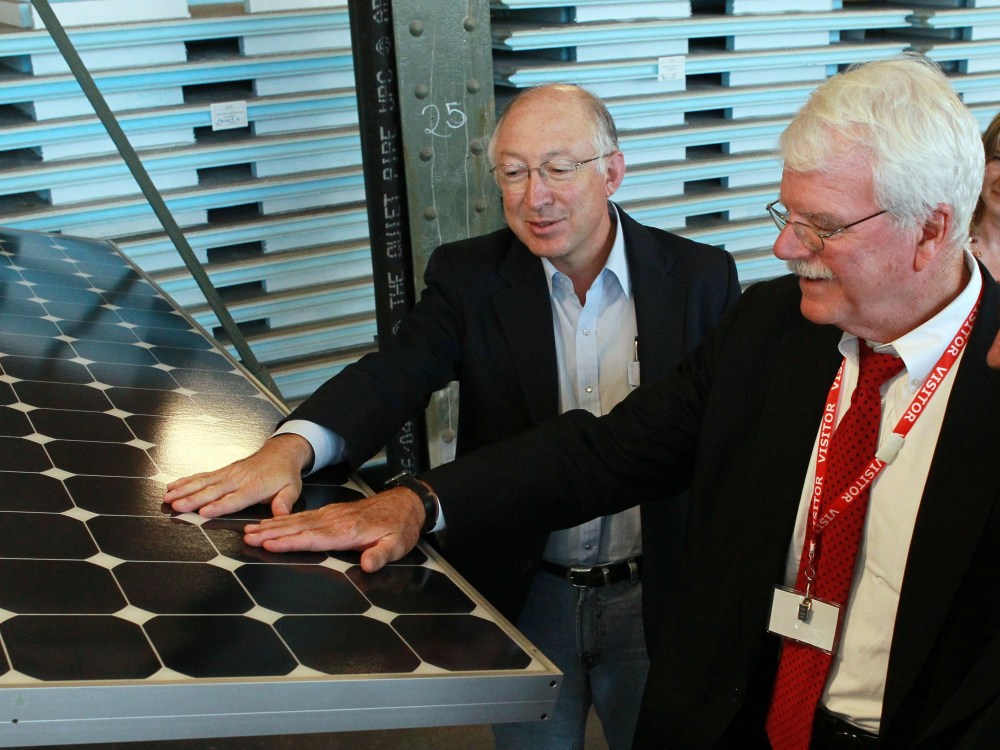 File Photo: U.S. Secretary of the Interior Ken Salazar (L) and U.S. Rep. George Miller (D-CA) touch a solar panel as they tour Sunpower Corporation's research and development facility October 14, 2010 in Richmond, California. Salazar signed a Record...