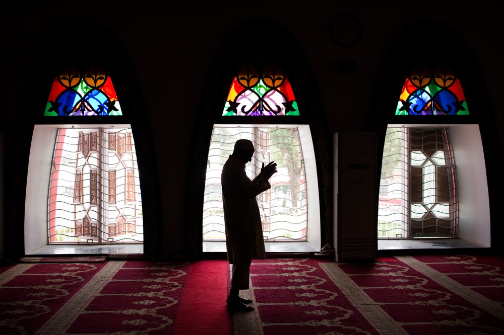 A Pakistani man performs Friday prayers at the Red Mosque in the capital Islamabad on July 8, 2011. (Photo by Behrouz Mehri/AFP/Getty)