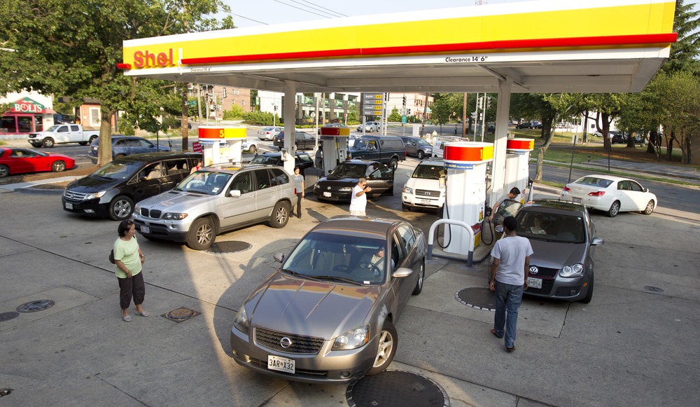 Drivers crowd a gas station in the Tenleytown section of Washington, D.C., June 30, during a massive power outtage resulting from a powerful storm late Friday.