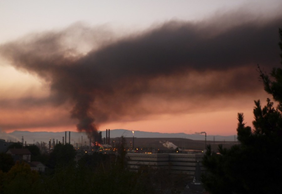 A plume of smoke emits from a fire that broke out at a Chevron oil refinery in Richmond, California August 6.