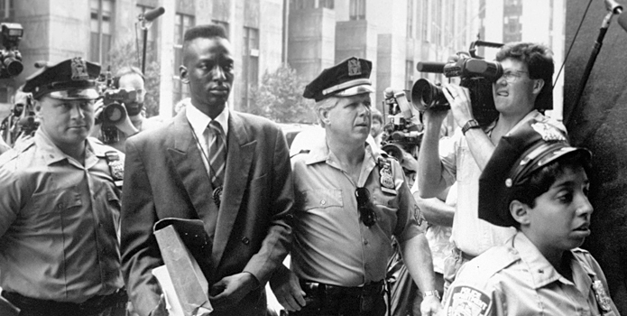 This film image released by Sundance Selects shows accused rapist Yusef Salaam being escorted by  police in New York in 1990. Salaam is the subject of the documentary, "The Central Park Five" (Photo: AP Photo/Sundance Selects, NY Daily News)