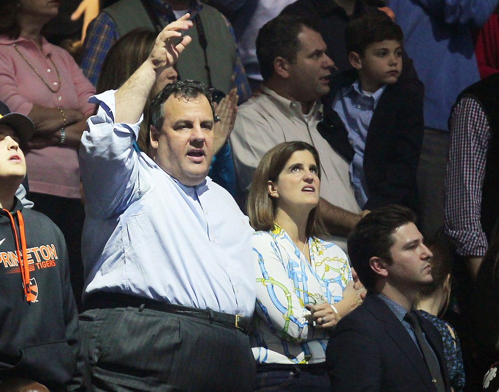 This image released by Starpix shows New Jersey Gov. Chris Christie, center, at the 12-12-12 The Concert for Sandy Relief at Madison Square Garden in New York on Wednesday, Dec. 12, 2012. (AP Photo/Starpix, Dave Allocca)