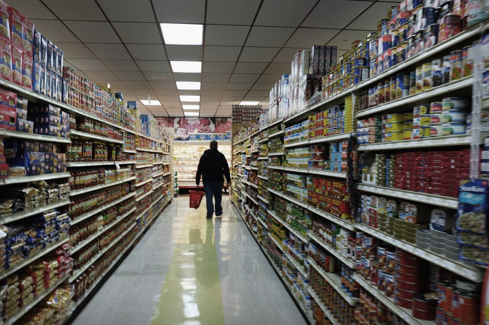A man walks through a grocery store in Bridgeport, Connecticut.