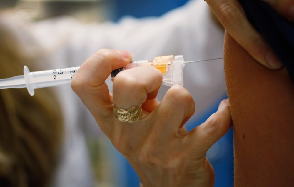 A doctor administers an HPV vaccination to a patient in her office on Sept. 21, 2011 in Miami, Florida.