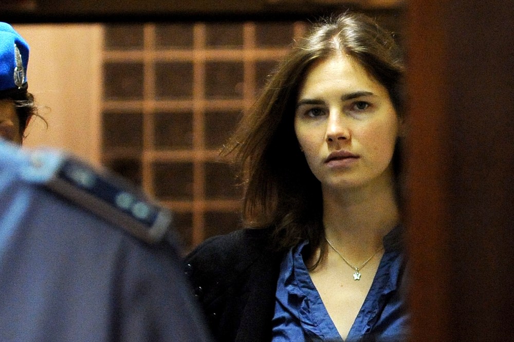 Amanda Knox (R), US national accused of the 2007 murder of her housemate Meredith Kercher arrives at the court during the resumption of her appeal trial in Perugia on Sept. 30, 2011. (Photo by Tiziana Fabi/AFP/Getty)