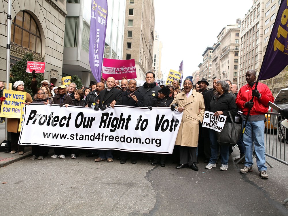 File Photo: (L-R) Lillian Rodriguez Lopez, Dr. Hazel N. Dukes, George Gresham, Michael Mulgrew, John Payton, Rev. Al Sharpton, Benjamin Jealous, Barbara Arnwine and U.S. Rep. Charles Rangel attend a march to protect voting rights on the United Nations...