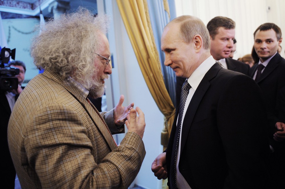 Russia's Prime Minister Vladimir Putin speaks with Ekho Moskvy radio editor-in-chief Alexei Venediktov during an awarding ceremony in Moscow, Jan. 13, 2012.