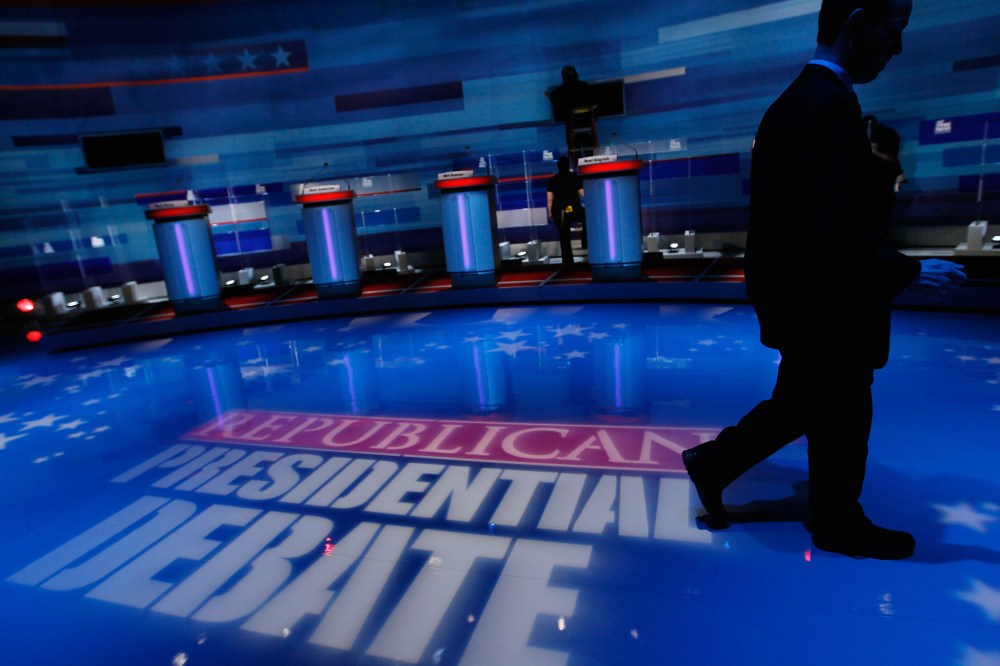 Workers prepare the stage for the Fox News/Wall Street Journal/South Carolina GOP debate at the Sheraton Myrtle Beach Convention Center on Jan. 16, 2012 in Myrtle Beach, S.C. (Photo by Joe Raedle/Getty)