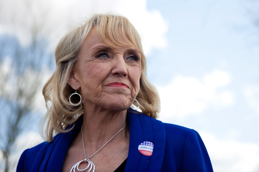 Arizona Gov. Jan Brewer talks to news media after voting in the Republican presidential primary on Feb. 28, 2012 in Glendale, Ariz.
