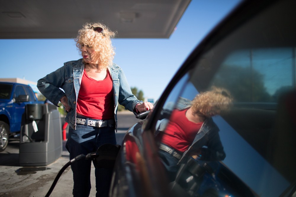 Denee Mallon pumps gas into her Ford Mustang in Albuquerque, N.M. Mallon is an Army veteran and transgender woman and is about to be the first person to have Medicare pay for her male to female sex reassignment surgery, Oct. 1, 2014. (Jim Seida/NBC News)