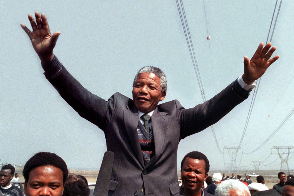 Nelson Mandela salutes supporters on Sept. 5, 1990 in Tokoza, South Africa.