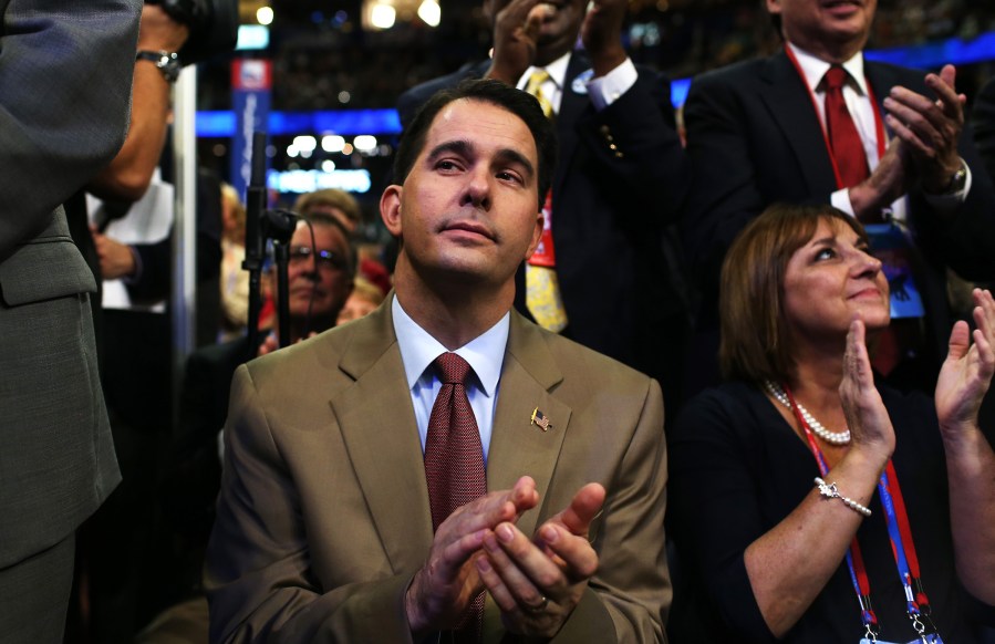 Wisconsin Gov. Scott Walker claps during the third day of the Republican National Convention at the Tampa Bay Times Forum on Aug. 29, 2012 in Tampa, Fla.