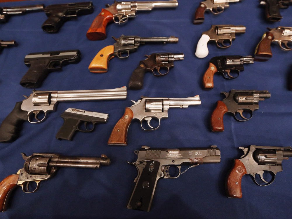 A table of illegal firearms confiscated in a large weapons bust in East Harlem are on display at a press conference on October 12, 2012 in New York City.  (Mario Tama / Getty Images)