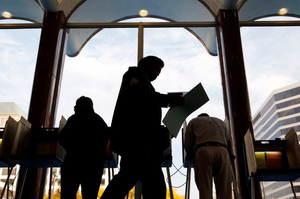 Milwaukee residents cast their ballots during early voting at the Milwaukee Municipal Building on Oct., 22, 2012 Milwaukee, Wis.