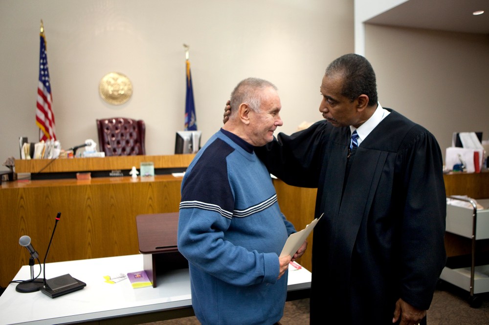 Veteran Richard Wilkiewicz (L) is congratulated by Judge Robert Russell at the Buffalo Veterans Treatment Court as he successfully completed his program, on Oct. 23, 2012 in Buffalo, New York.