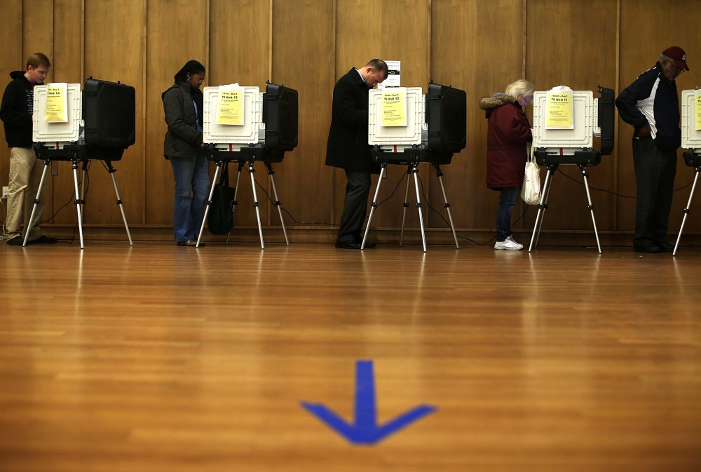 Voters cast their ballots as they participate in early voting, Nov. 2, 2012 in Silver Spring, Maryland.