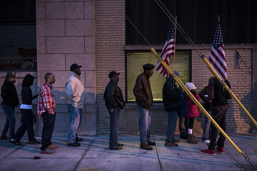 Voters wait in front of the Mt. Pleasant Library November 6, 2012 in Cleveland, Ohio. (Photo by Brendan Smialowski/AFP/Getty Images)