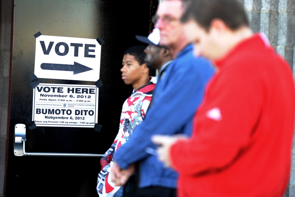People wait in line to vote before the polling station at the Clark County Fire Training Center opens on Nov. 6, 2012 in Las Vegas, Nev.