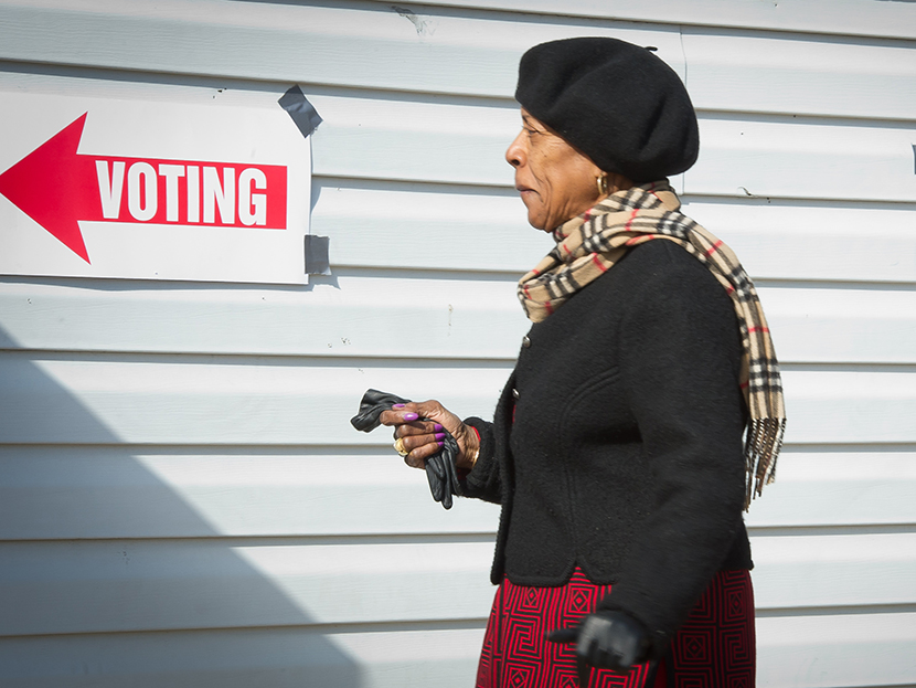 A voter walks toward the polling station to cast her ballot at the Nativity's "Don Bosco" youth center in Washington, DC on November 6, 2012. (Photo by Mladen Antonov/AFP/Getty Image)