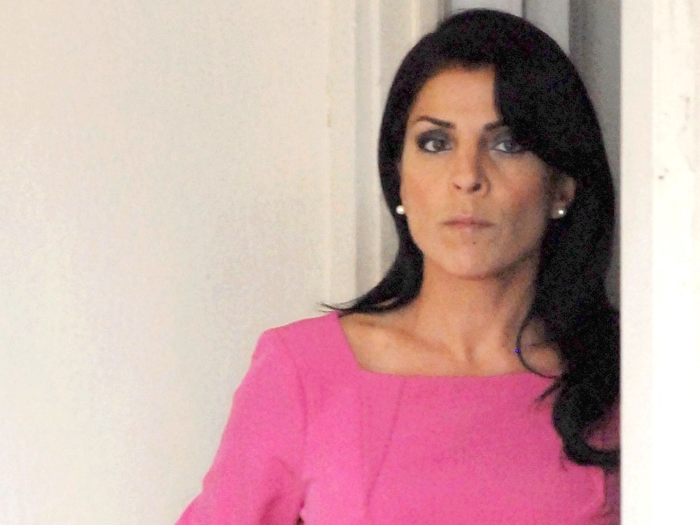 Jill Kelley leaves her home on November 13 in Tampa, Fla. Kelley reported receiving harassing emails to the FBI, which resulted in an investigation that revealed an affair between Paula Broadwell and CIA Director David Petraeus.  (Photo by Tim Boyles...