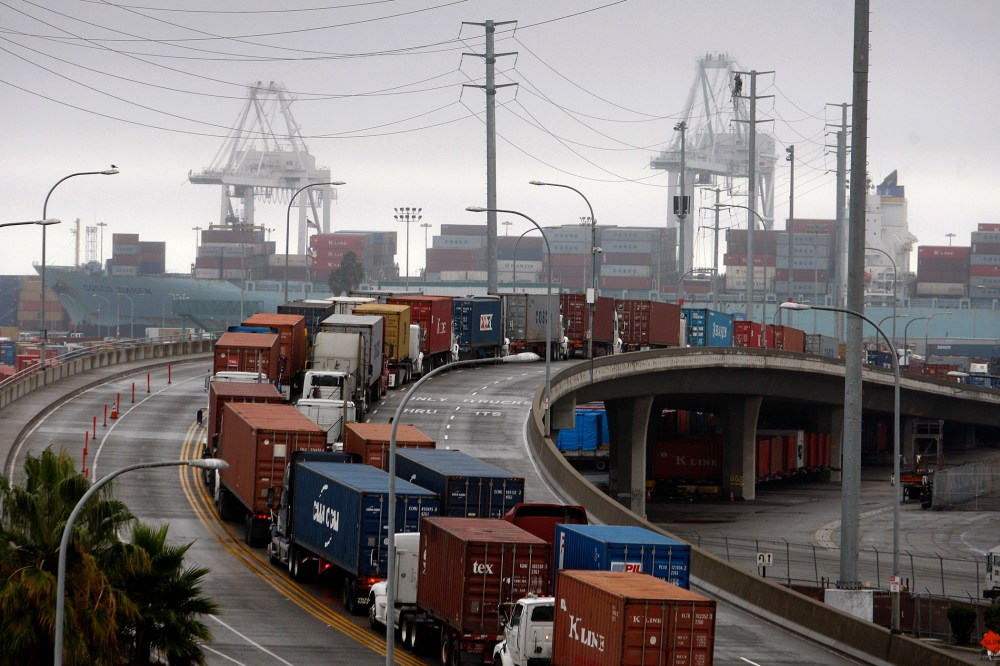 Shipping container trucks sit in traffic at the seaport, Nov. 29, 2012 in Long Beach, Calif.