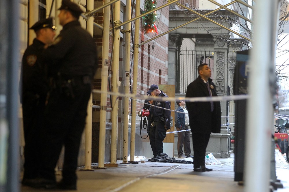 Police investigate the scene of a fatal shooting at 202 West 58th Street in Manhattan on Dec. 10, 2012 in New York City.