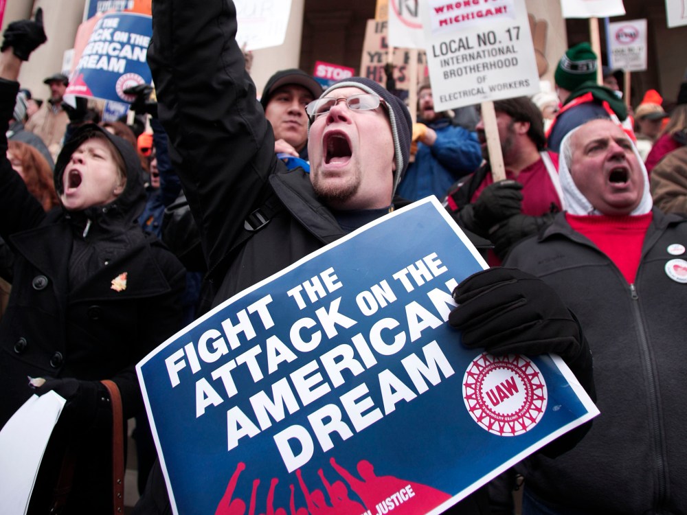 Craig Cable, of Newport, Michigan, a member of United Auto Workers Union Local 3000, and union members from around the country, rally at the Michigan State Capitol to protest a vote on Right-to-Work legislation December 11, 2012 in Lansing, Michigan....
