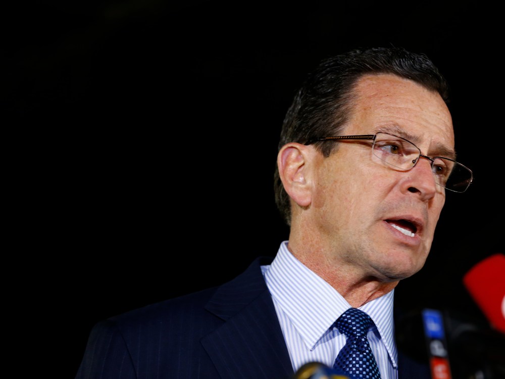 NEWTOWN, CT - DECEMBER 14:  Connecticut Gov. Dan Malloy briefs the media on the elementary school shootings during a press conference at Treadwell Memorial Park on December 14, 2012 in Newtown, Connecticut. (Photo by Jared Wickerham/Getty Images)