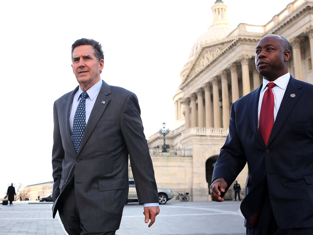 U.S. Rep. Tim Scott (R-SC) (R) leaves the weekly Senate Republican Policy Luncheon at the U.S. Capitol with Sen. Jim DeMint (R-SC) December 18, 2012 on Capitol Hill in Washington, DC.