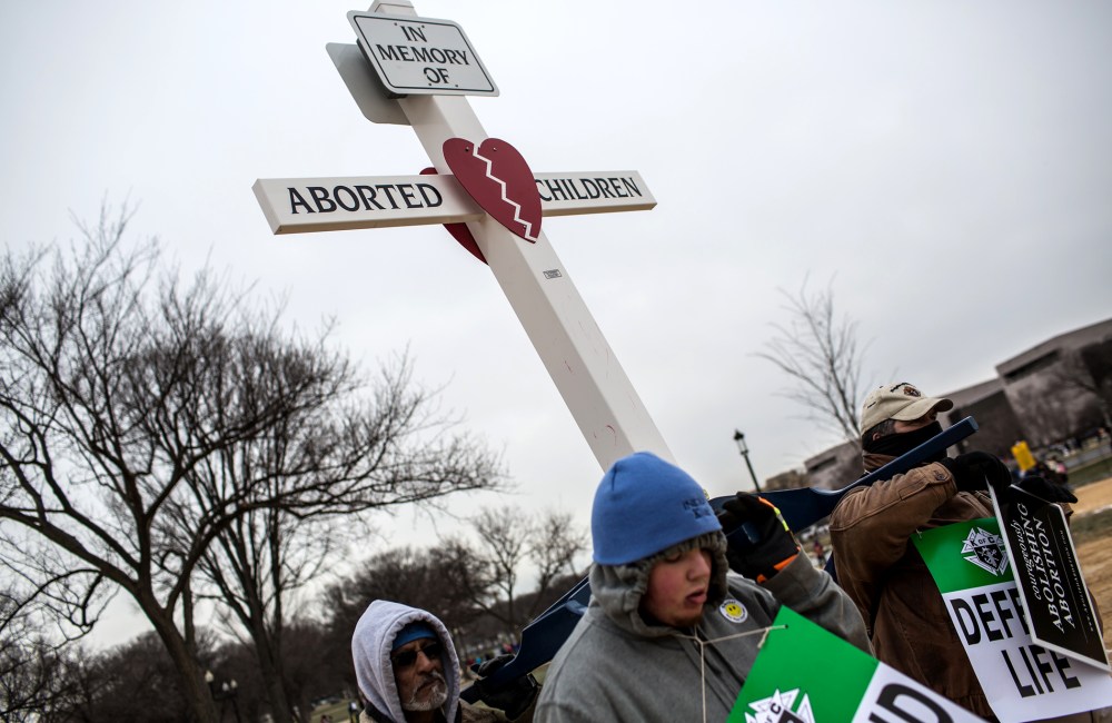 Anti-abortion protesters carry a cross at the March for Life on Jan. 25, 2013 in Washington, DC.