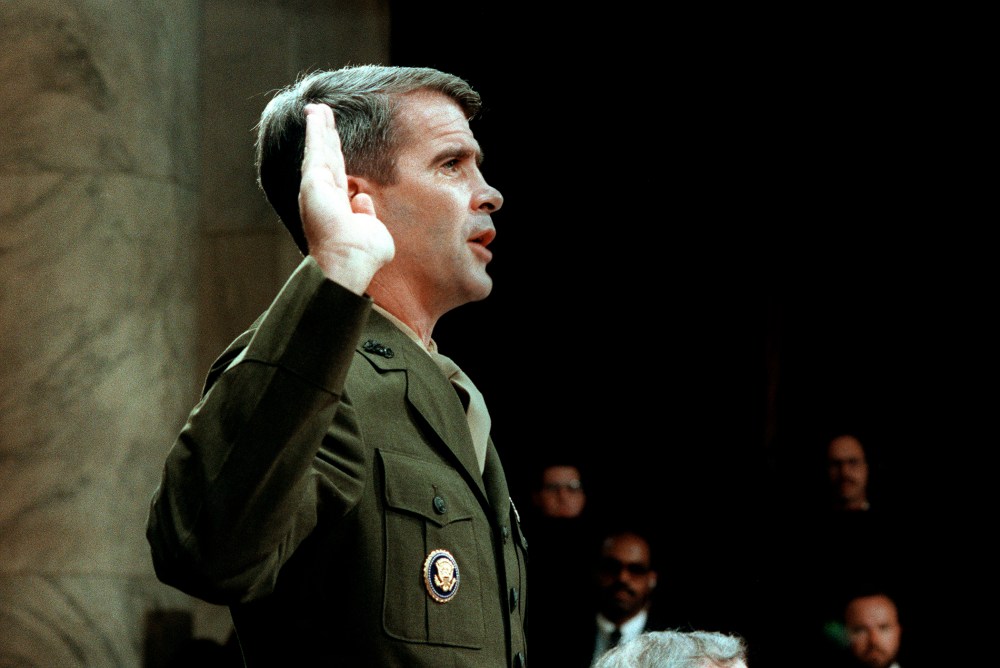 Lieutenant-Colonel Oliver North is sworn in July 7, 1987 before the House and Senate Foreign Affairs Committee hearing in Washington, D.C. on arms sales to Iran and diversion of profits to Nicaraguan Contra rebels.